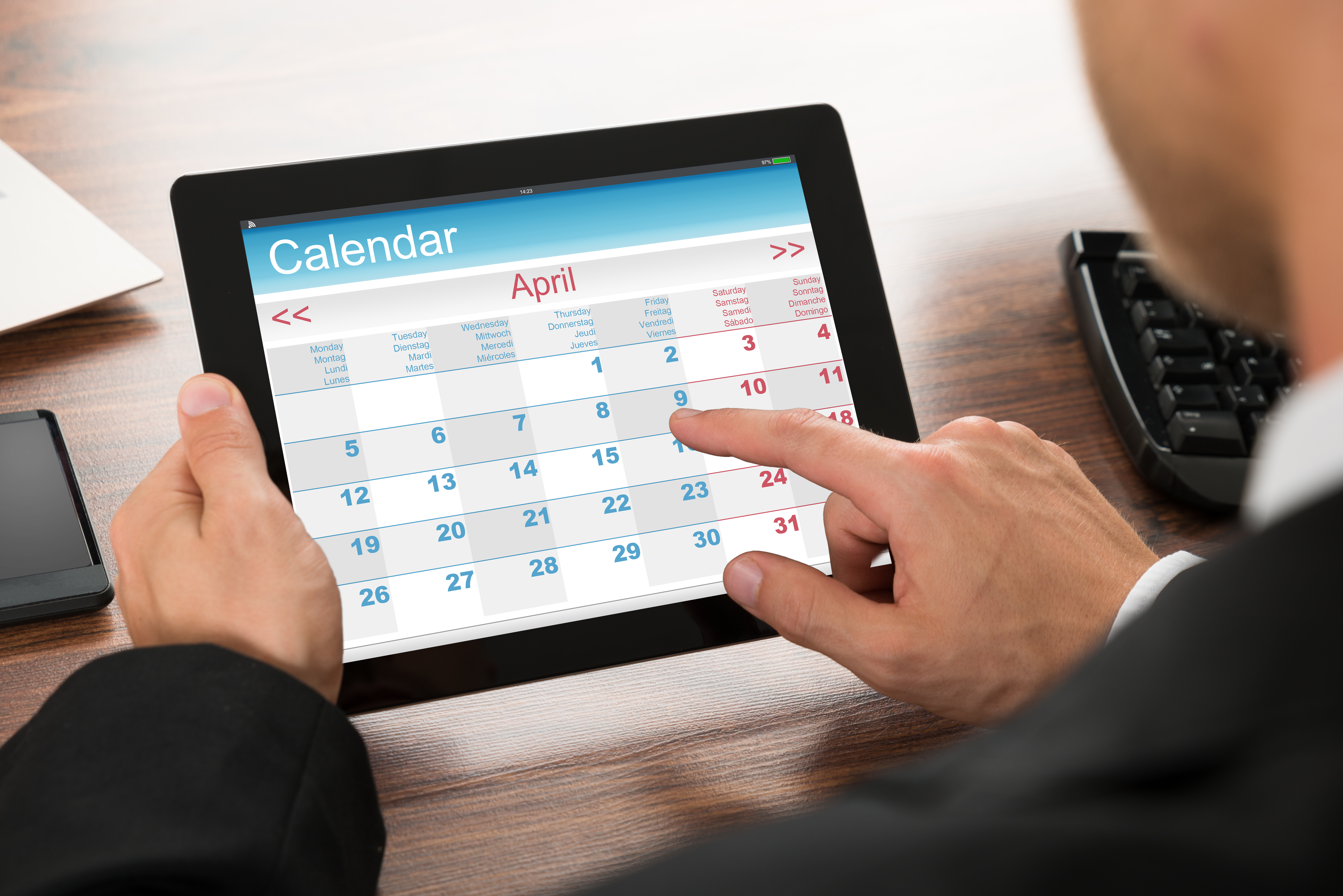 Businessman Using Calendar On Digital Tablet